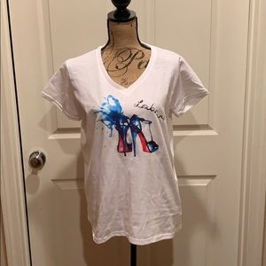 Graphic T shirt. Blue heels with red botto…